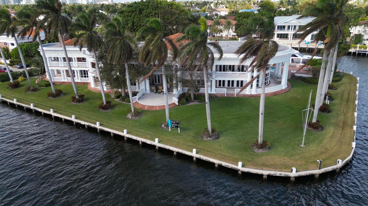 View of the of La Maison Blanche —the White House — a 1930s neoclassical estate on the Intracoastal on a 1-acre plot of land, in Fort Lauderdale on Saturday, Dec. 23, 2023. The home was the site of an auction of its content. The mansion will be demolished in a couple weeks and will be replaced by a 20,000-square-foot modernist home.