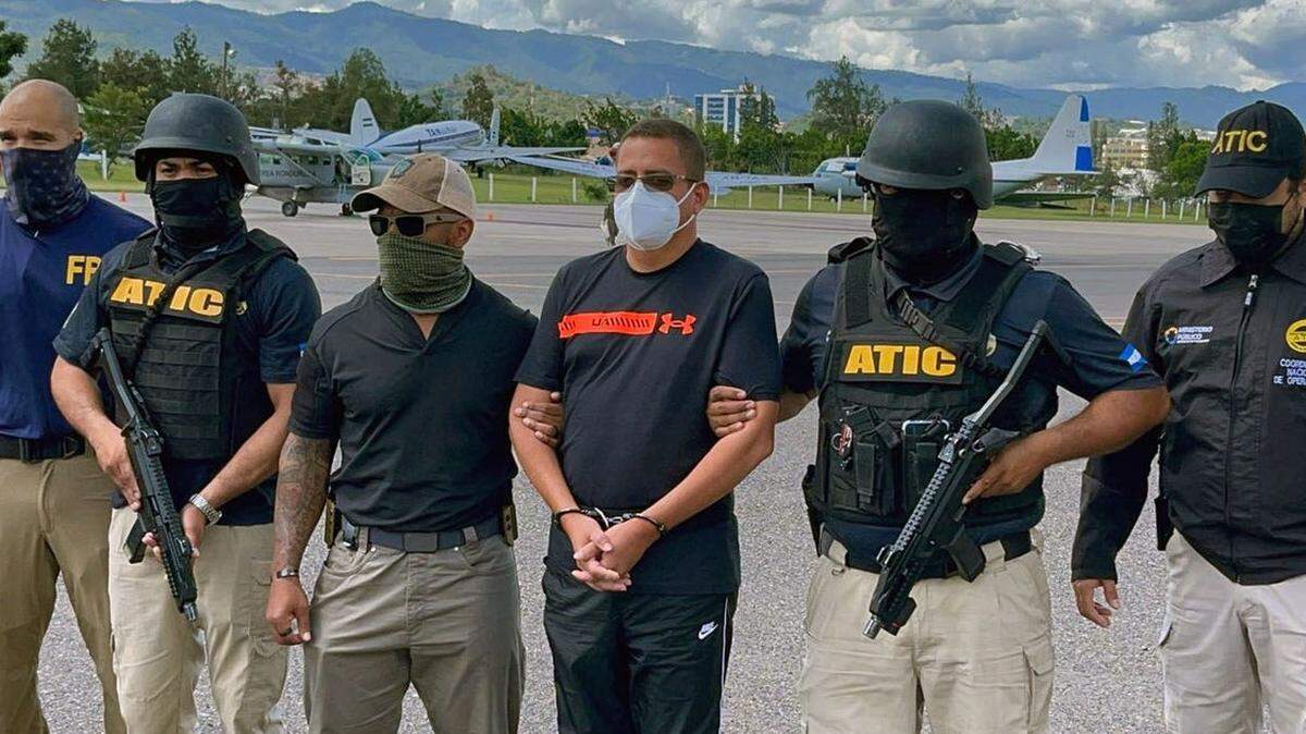 Reputed Honduran drug lord Fredy Mármol, escorted by Honduran authorities, was extradited to Miami this week to face cocaine smuggling charges. (Honduran government handout)