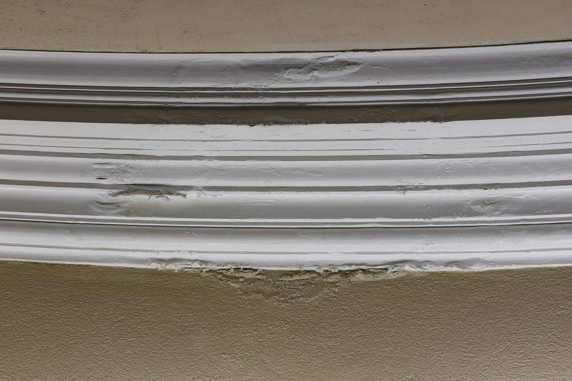 Wood ceiling moldings in the commission chamber at Coral Gables City Hall show signs of water damage from leaks that plague the historic building, which will undergo a comprehensive restoration expected take up to three years.