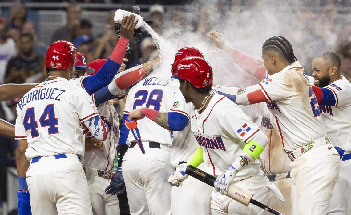Dominican Republic catcher Austin Wells (28) celebrates with his teammates after hitting a home run and winning his  World Baseball Classic quarterfinal game against Korea at loanDepot park on Friday, March 13, 2026, in Miami, Fla.