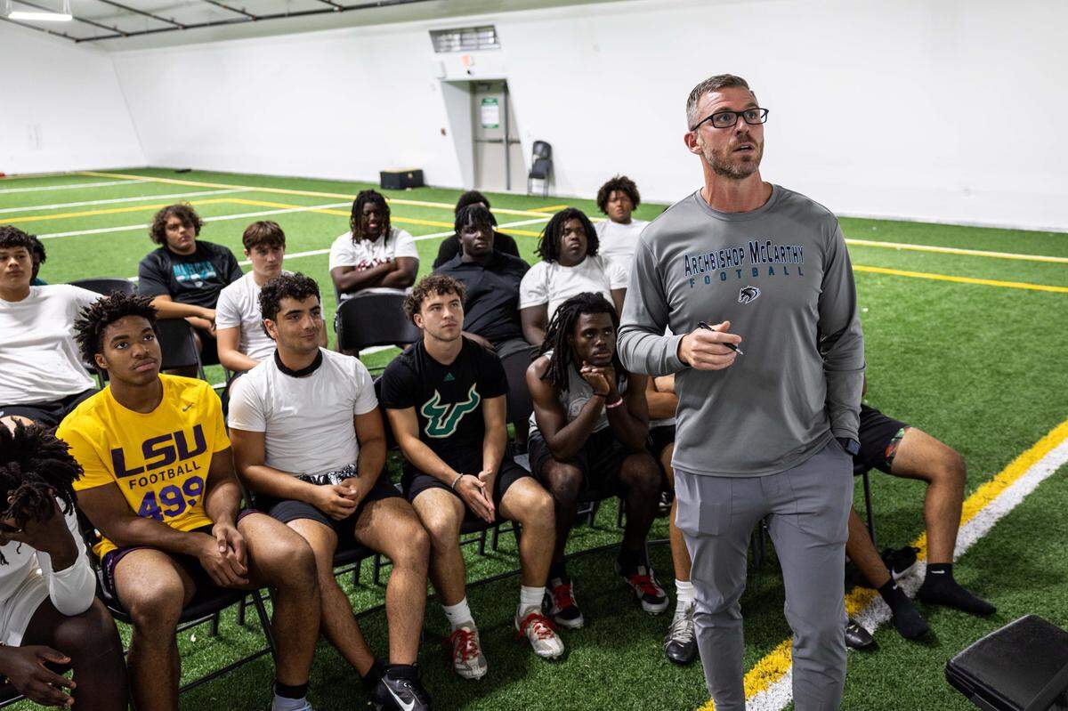 Football Head Coach Jake Pew speaks to players inside the new Jordan Family Foundation Athletic Center at Archbishop McCarthy on Wednesday, October 22, 2025, in Fort Lauderdale, Fla.
