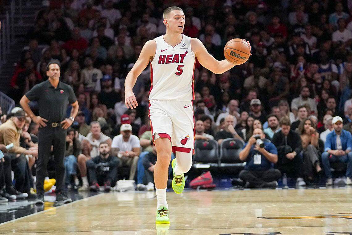 Nikola Jović #5 of the Miami Heat brings the ball down the court during the third quarter against the Portland Trail Blazers at Kaseya Center on November 08, 2025 in Miami.