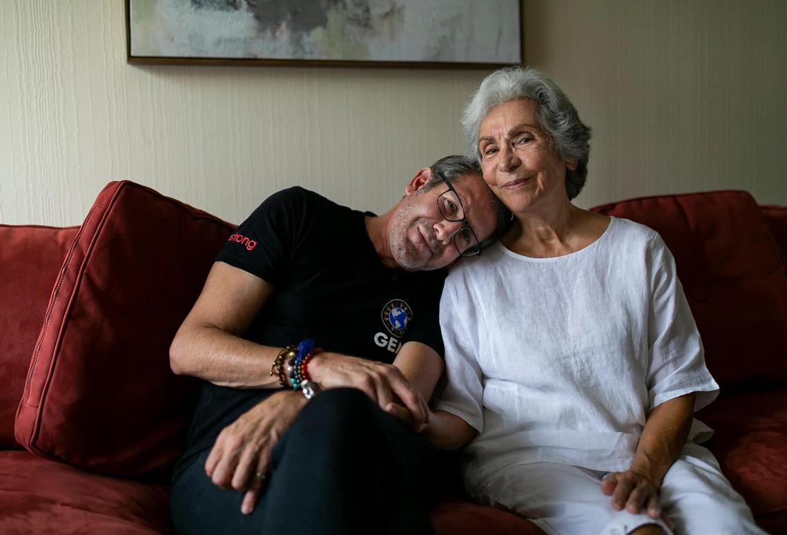 Zulia Taub, who survived the Champlain Towers South condo collapse is photographed with Michael Capponi in a friend’s vacant apartment in Sunny Isles Beach on Wednesday, July 7, 2021. Capponi, of Global Empowerment Mission, has been providing relief to survivors like Taub.