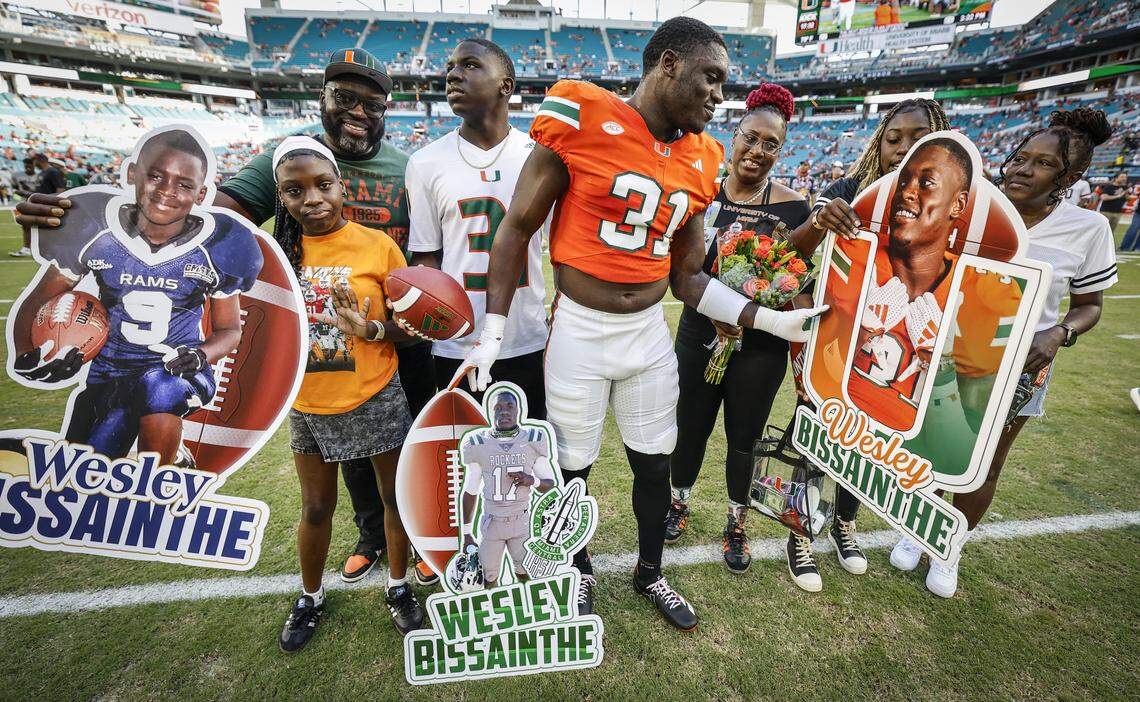 Miami Hurricanes linebacker Wesley Bissainthe (31) celebrates Senior Day with family before the NCAA football game against the NC State Wolfpack at Hard Rock Stadium in Miami Gardens, Florida, on Saturday, November 15, 2025.