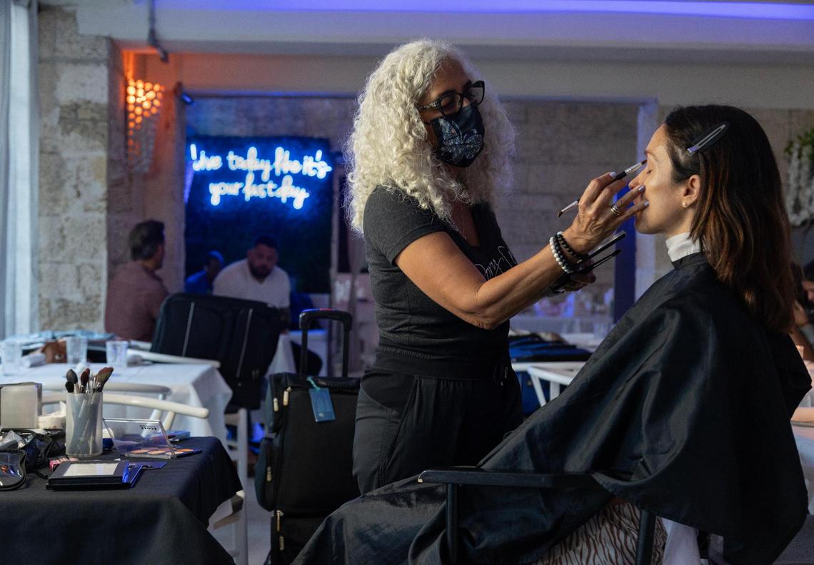 Lee touches up actress Patricia Gonzalez’s face. “It’s just been amazing – the journey,” Lee said. “The journey and just the love and the passion for still the science of skin and taking care of my clients.”