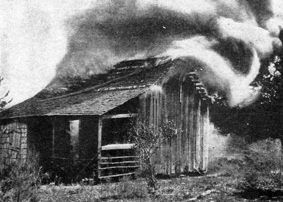 The home of African-American residents burns during the 1923 race riot in Rosewood.