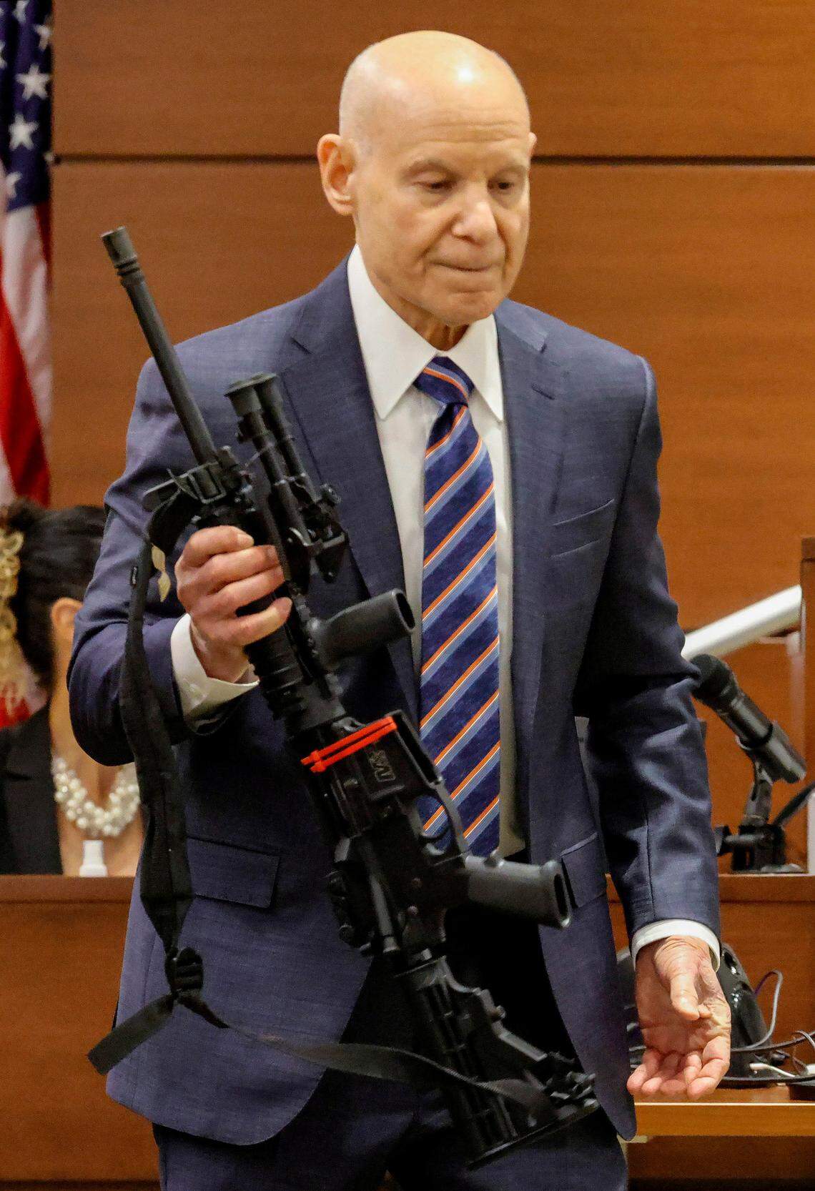 Assistant State Attorney Mike Satz checks into evidence the weapon used in Parkland’s Marjory Stoneman Douglas High School shooting during the sentencing trial for Nikolas Cruz at the Broward County Courthouse in Fort Lauderdale.