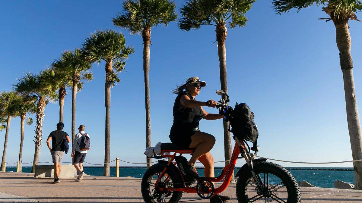 A cyclist visits South Pointe Park on Monday, Feb. 27, 2023, in Miami Beach, Fla. Forecasters expect temperatures to be around 90 degrees this week across South Florida.