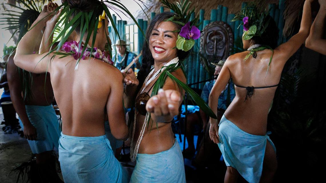 A Mai-Kai dancers smile during their opening dance ceremony at the reopening of Mai-Kai in Fort Lauderdale. The restaurant had been closed for four years before reopening under new ownership.