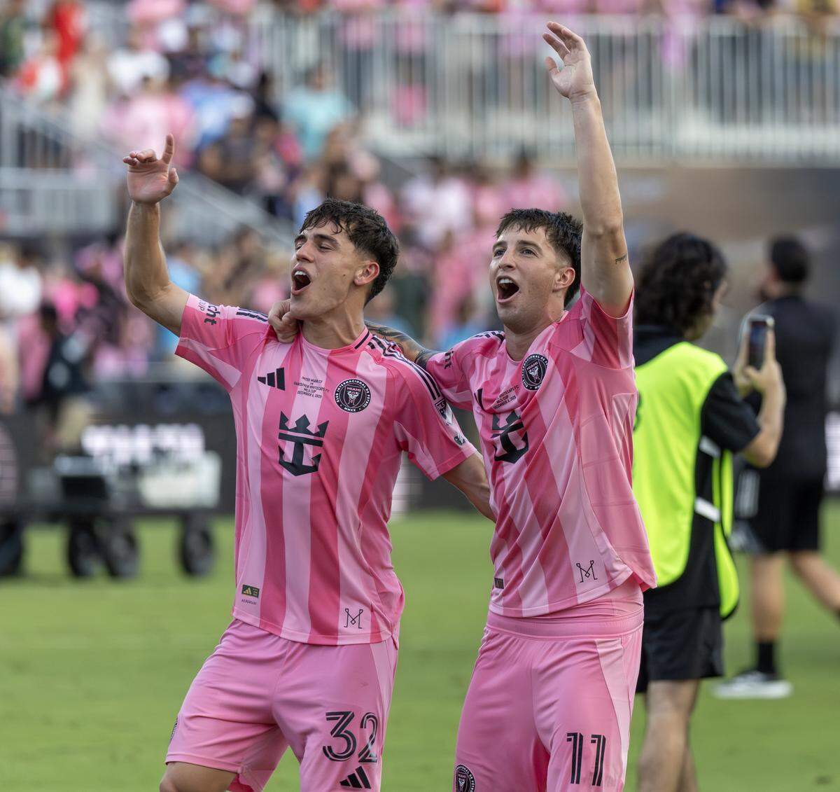 Inter Miami defender Noah Allen (32) and midfielder Baltasar Rodríguez (11) celebrate after a 3-1 win over the Vancouver Whitecaps to capture the club’s first MLS Cup at Chase Stadium on Saturday, Dec. 6, 2025, in Fort Lauderdale, Fla.