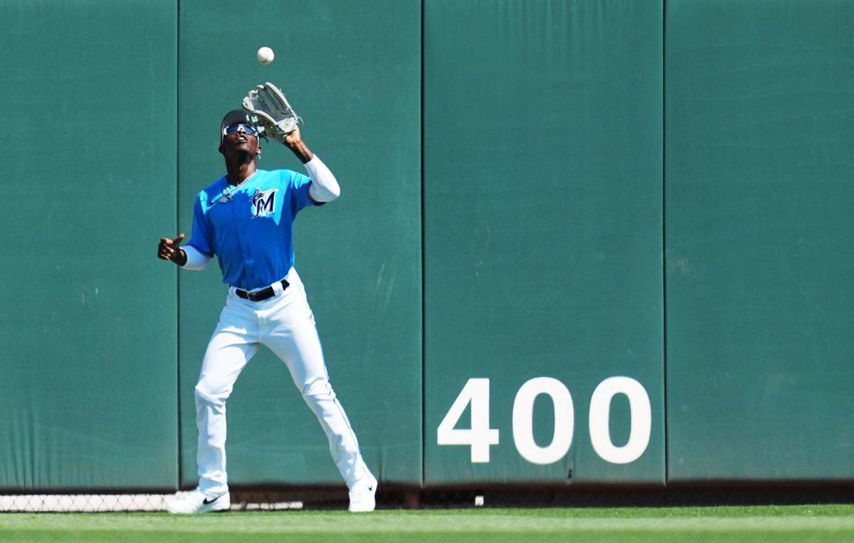 Miami Marlins center fielder Jazz Chisholm Jr. (2) catches a fly ball for an out in the first inning against the New York Mets at Roger Dean Stadium on March 1, 2023, in Jupiter, Florida.