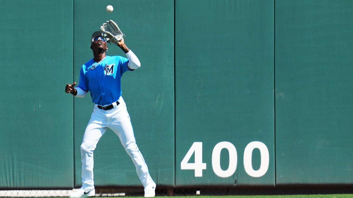 Miami Marlins center fielder Jazz Chisholm Jr. (2) catches a fly ball for an out in the first inning against the New York Mets at Roger Dean Stadium on March 1, 2023, in Jupiter, Florida.