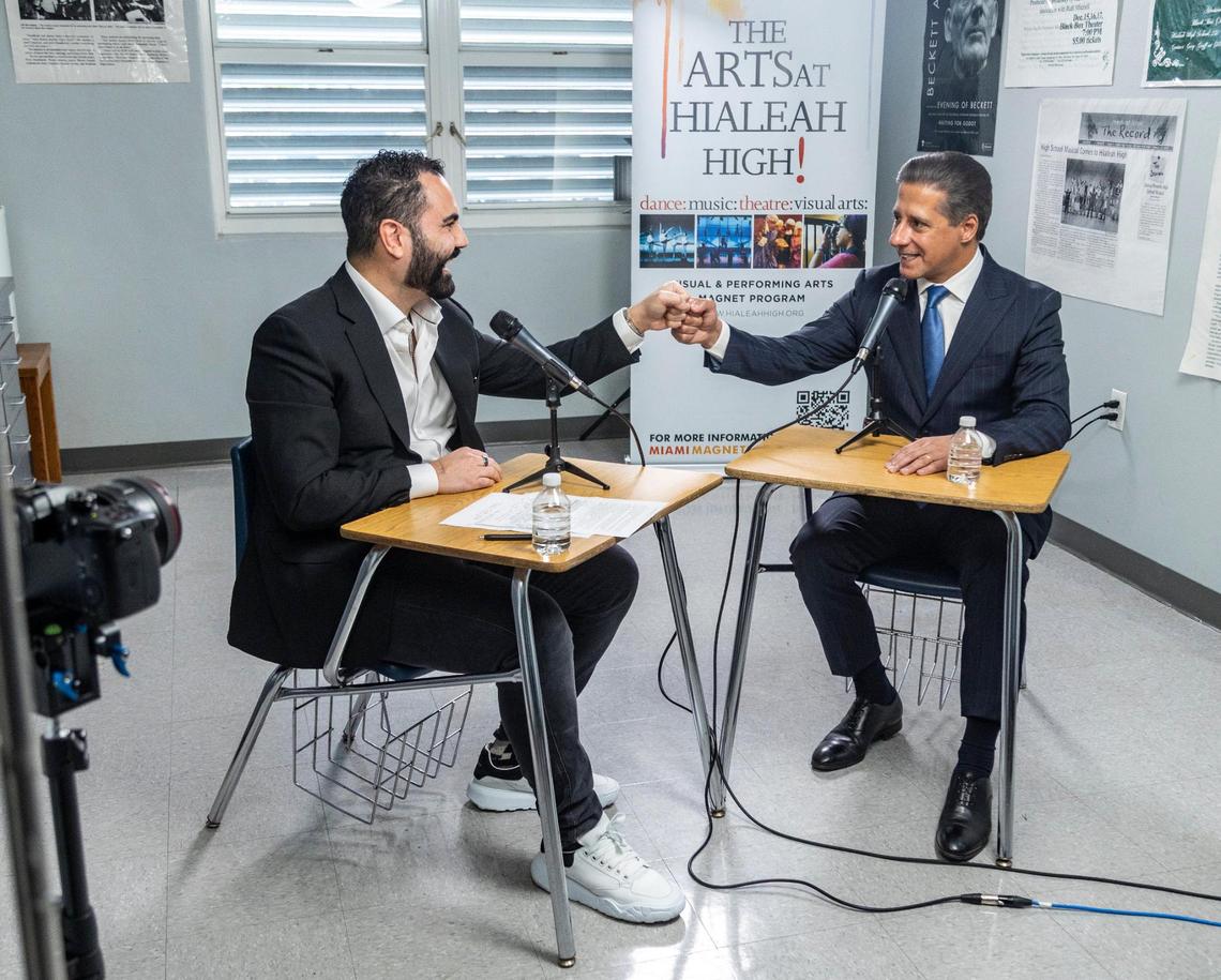 Alberto Carvalho fist bumps Enrique Santos, left, during a taping of Santos’ podcast at Hialeah Senior High on Feb. 3, 2022. 