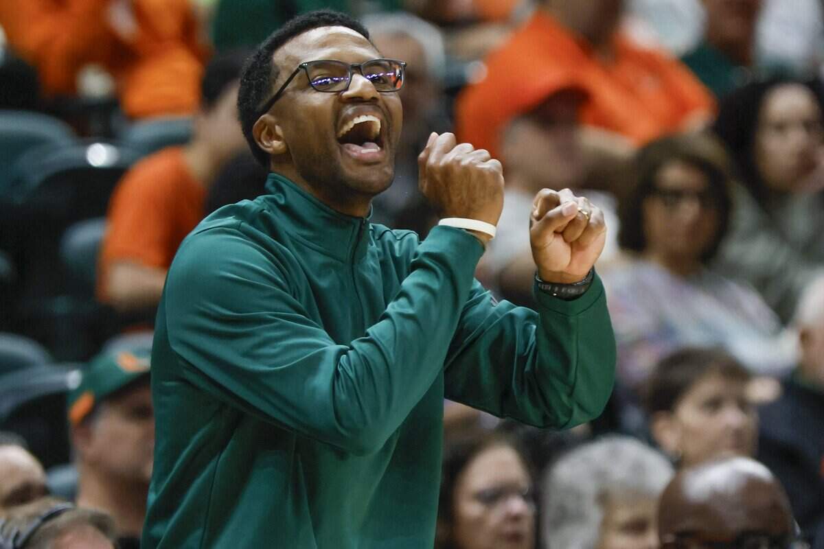 Miami Hurricanes head coach Jai Lucas signals towards the players during the second half lof the basketball game against the Boston College Eagles at the University of Miami's Watsco Center in Coral Gables, Florida, on Saturday, February 28, 2026.