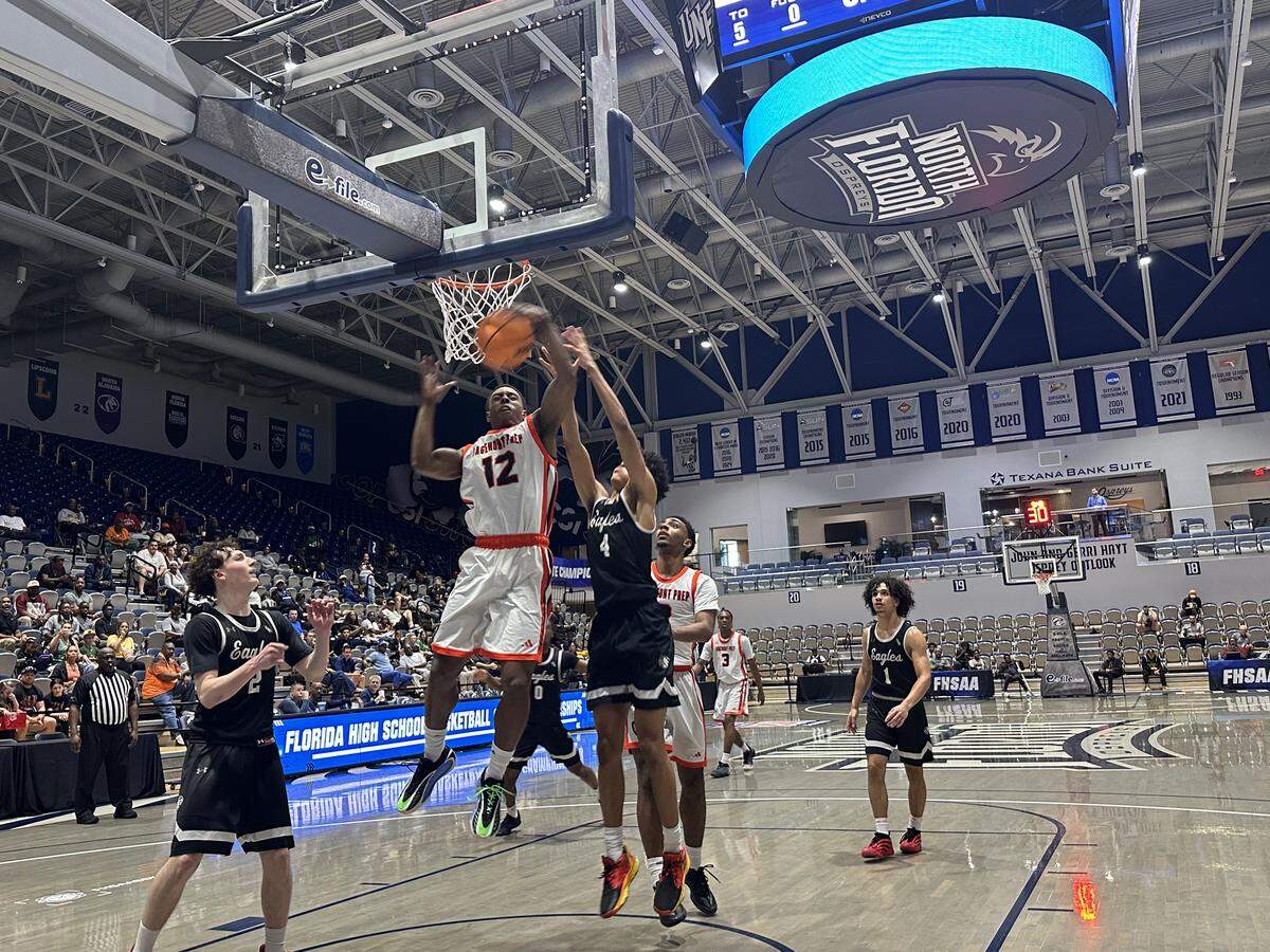 Sagemont’s David Nealy (12) soars for a rebound against Ocoee Central Florida Christian on Thursday in a Class 1A state semifinal at UNF Arena in Jacksonville, Fla.