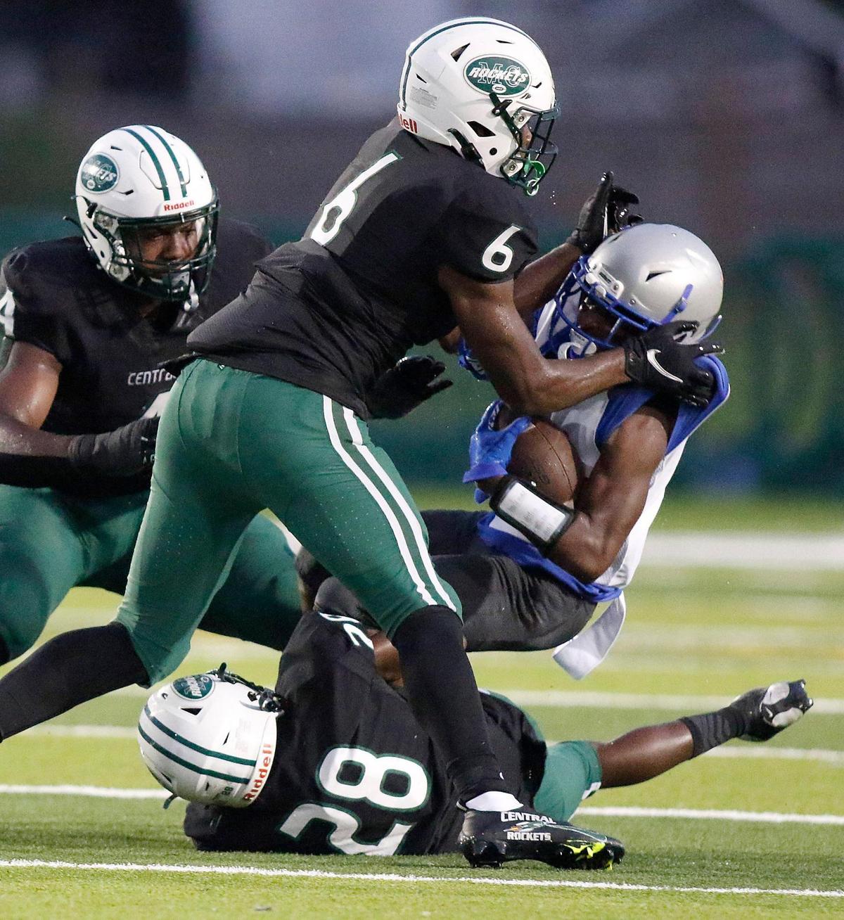 Miami Central Rockets linebacker Stanquan Clark (6) brings down Dillard Panthers wide receiver Edward Louis during football game on Saturday, September 24, 2022 at Traz Powell Stadium in Miami. Andrew Uloza / for Miami Herald