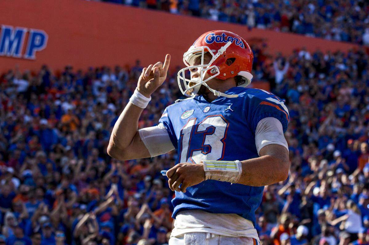 Florida quarterback Feleipe Franks (13) shushes the crowd after scoring a touchdown against South Carolina during an NCAA college football game, Saturday, Nov. 10, 2018, in Gainesville, Fla.