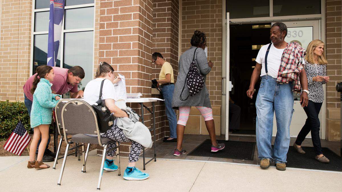 Voters enter the supervisor of elections office mega-voting site in Panama City, Florida, on Tuesday, Nov. 6, 2018. As Panama City recovers from Hurricane Michael, voters in Bay County were allowed to vote at any of the mega-voting sites across the county.