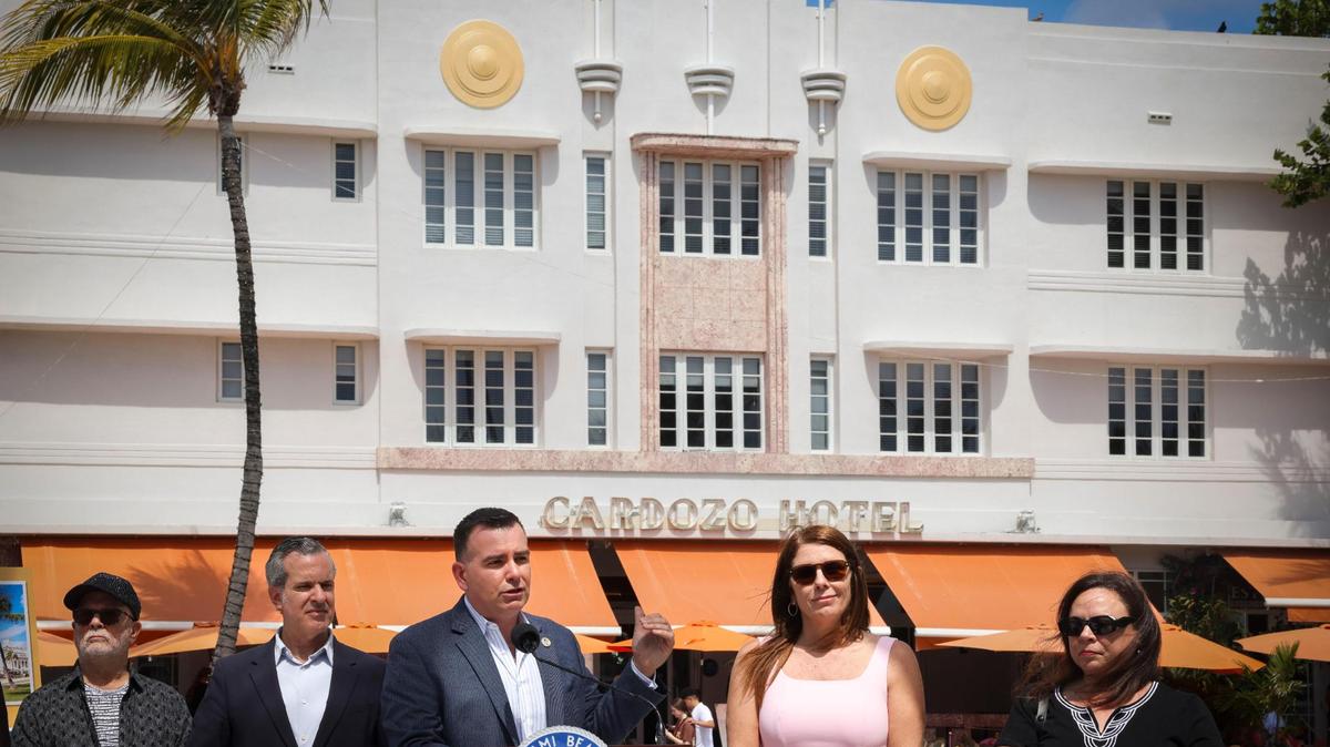 Miami Beach Commissioner Alex Fernandez, center, speaks against the proposed expansion of the state’s Live Local Act, which he says threatens the future of the city’s historic districts and buildings, during a news conference outside of the Cardozo Hotel on Ocean Drive on April 29.