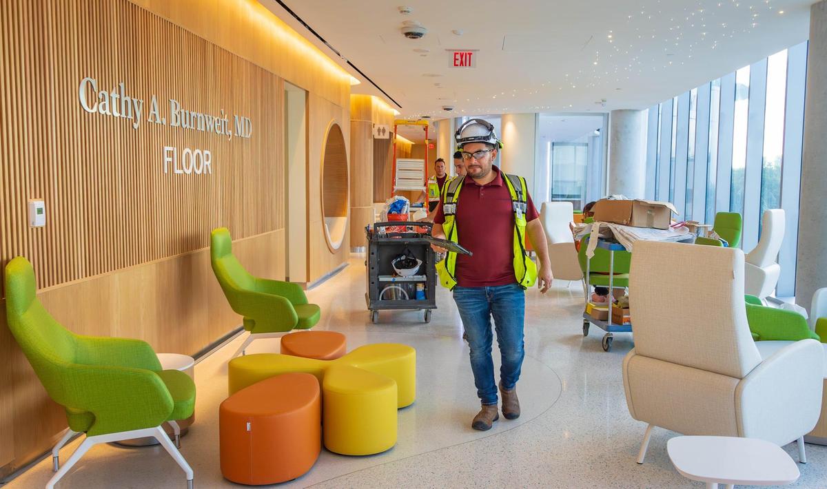 Construction workers make progress on the third floor of the new Kenneth C. Griffin surgical tower at Nicklaus Children’s Hospital on Wednesday, Sept. 18, 2024, in Miami, Fla. The design of the building is meant to provide a safe and spacious atmosphere for children and parents.