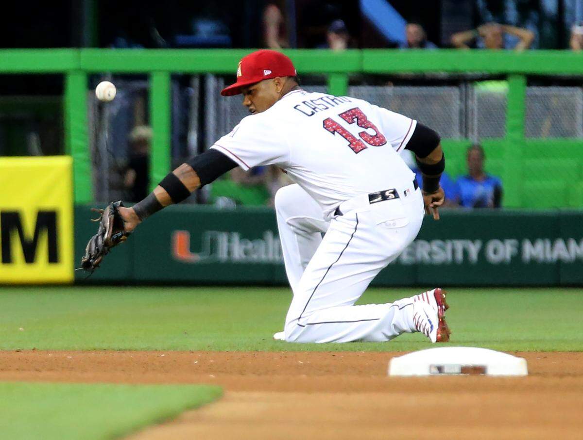 Miami Marlins Starlin Castro misses a grounder in the fourth inning as they play the Tampa Bay Rays at Marlins Park in Miami, Florida, July 2, 2018.