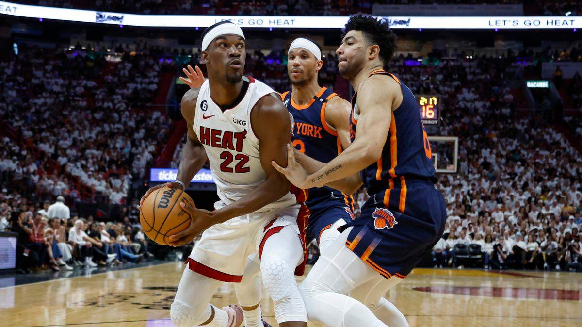 Miami Heat forward Jimmy Butler (22) looks towards the basket as guard Quentin Grimes (6) and New York Knicks guard Josh Hart (3) defend during the second quarter in Game 6 of the NBA Eastern Conference Semifinals at the Kaseya Center in Miami on Friday, May 12, 2023.