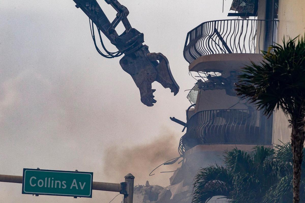 Miami-Dade County Fire Rescue crews uses heavy machinery early Friday morning as they work on the piles of rubble of the Champlain Towers South Condo, located at 8777 Collins Avenue in Surfside, that collapsed Thursday morning, on Friday, June 25, 2021.