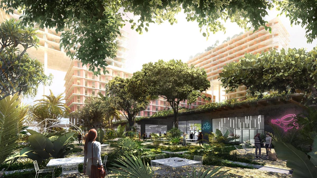 An architectural rendering of the planned Miami Produce redevelopment project shows how new towers would float on stilts over existing warehouse buildings and lushly landscaped grounds.