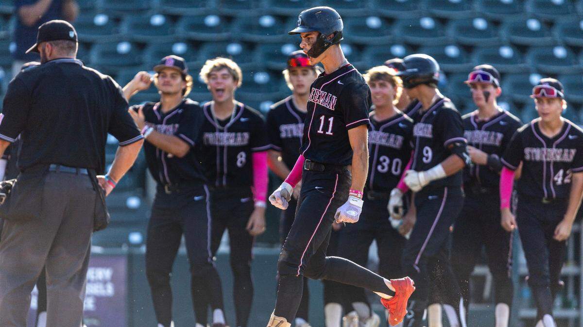 Marjory Stoneman Douglas base runner Nick Diaz (11) reacts to hitting a home run as he crosses home plate during the Class 7A semifinal state game against Vero Beach at Hammond Stadium on Friday, May 17, 2024, in Fort Myers, Fla.
