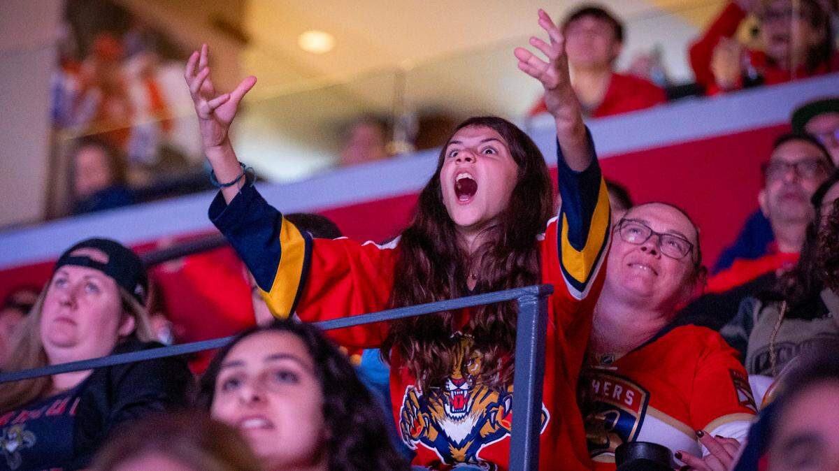A frustrated fan reacts as the hopes of a victory celebration begins to fade.
