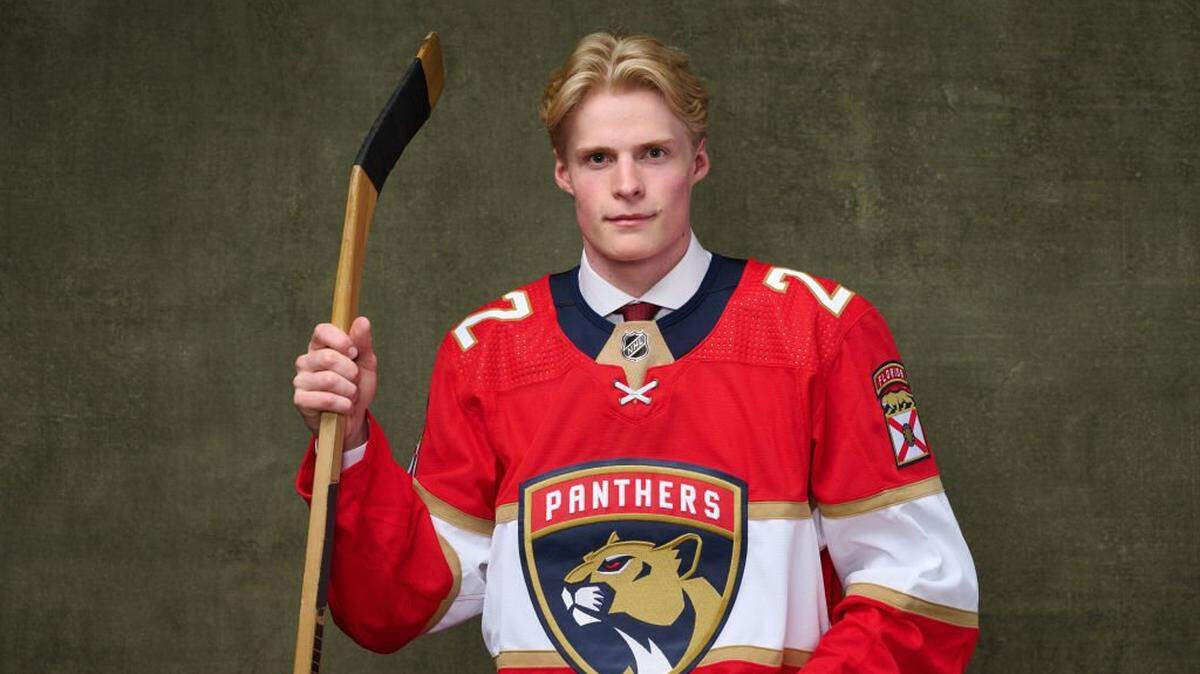 MONTREAL, QUEBEC - JULY 08: Jack Devine, #221 pick by the Florida Panthers, poses for a portrait during the 2022 Upper Deck NHL Draft at Bell Centre on July 08, 2022 in Montreal, Quebec, Canada. (Photo by Minas Panagiotakis/Getty Images)