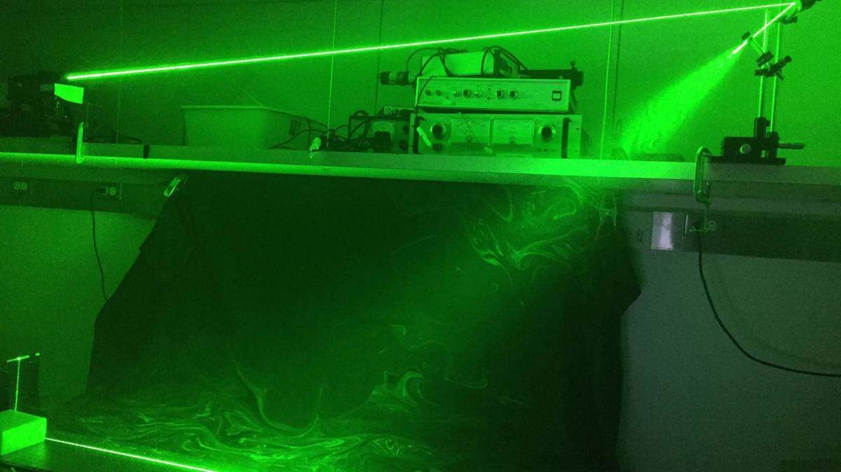 Princeton University researchers used a laser sheet to illuminate saliva droplets coming out of a speaking mouth.