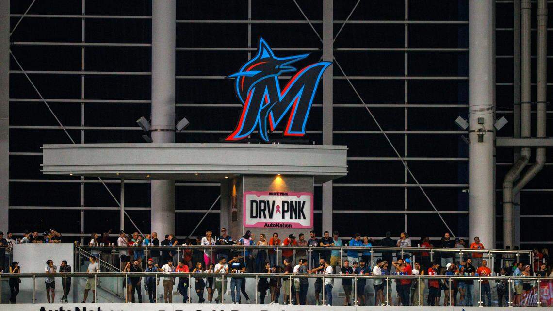 Baseball fans look from the AutoNation Alley Deck during the sixth inning of the season home opener baseball game between the Miami Marlins against the Philadelphia Phillies at LoanDepot Park on Thursday, April 14, 2022 in Miami, Florida.
