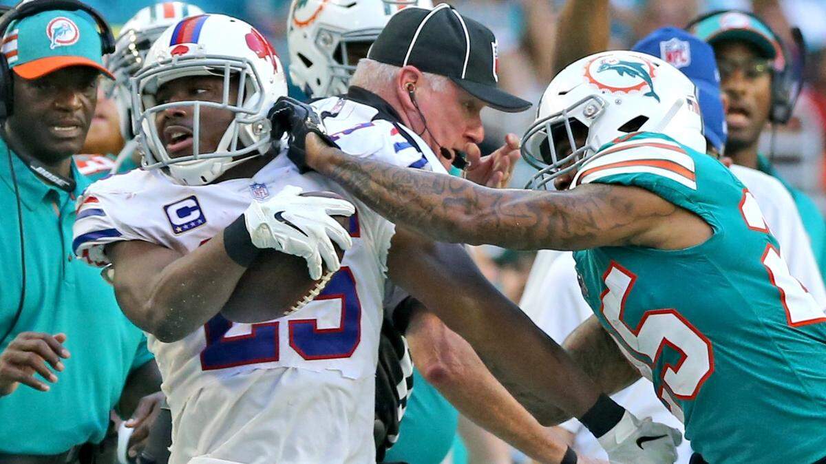 Miami Dolphins Xavien Howard pushes Buffalo Bills LeSean McCoy out of bounds in the fourth quarter and draws a penalty at Hard Rock Stadium in Miami Gardens, Florida, Sunday, December, 2, 2018.