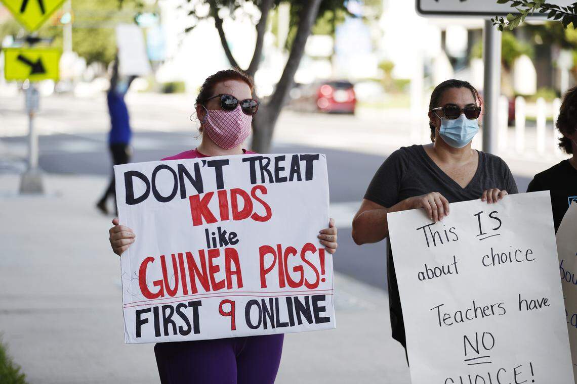 Teachers who oppose schools reopening during the COVID-19 pandemic protest ahead of the school board meeting to decide at the Hillsborough County Public Schools district office on Aug. 6, 2020, in Tampa, Florida.