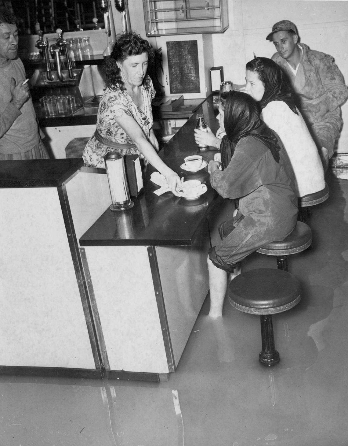 Shoppers sip coffee at a Fort Lauderdale food counter.