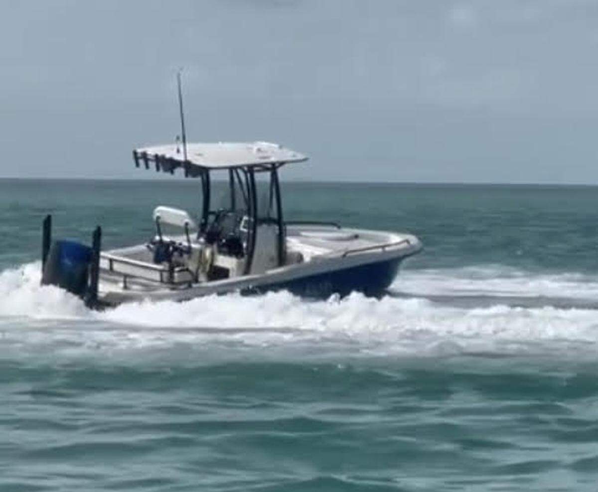 A pilotless boat spins out of control in the shallow Florida Bay water off Indian Key Fill in the Florida Keys Sunday, May 22, 2022. One person was killed after that boat hit a power line pole, ejecting the driver and six passengers into the water.