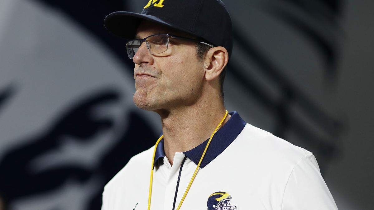 Michigan head coach Jim Harbaugh looks on before the start of play against Georgia in the Capital One Orange Bowl for the College Football Playoff semifinal game at Hard Rock Stadium on Dec. 31, 2021, in Miami Gardens, Florida. (Michael Reaves/Getty Images/TNS)