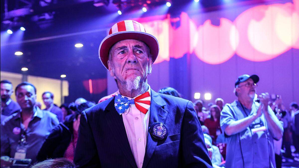 Duane Schwingel of Ocala, Florida and dressed as Uncle Sam listens to speakers during the Turning Point Action Conference at the Palm Beach County Convention Center in West Palm Beach, Florida, on Saturday, July 15, 2023.