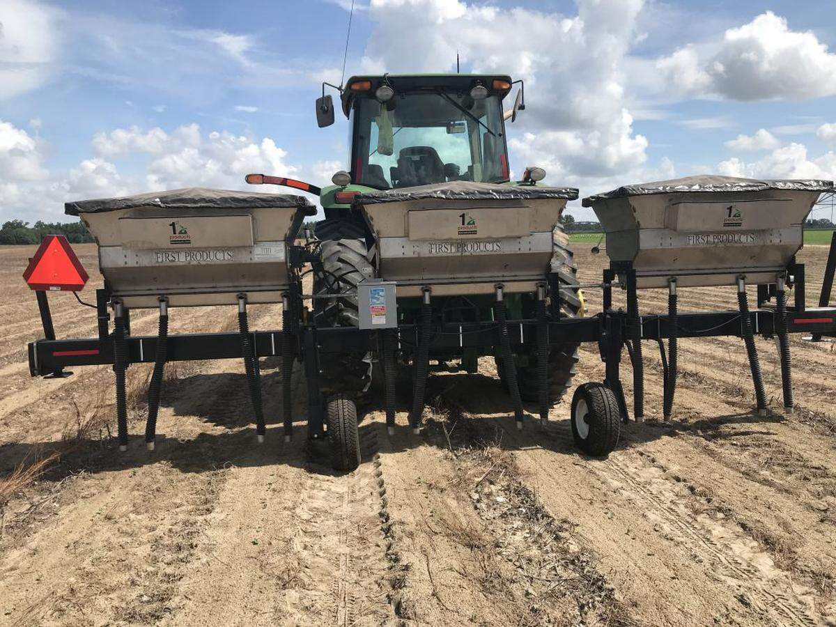 A “Banding Rig” in Marianna west of Tallahassee. The machine applies dry fertilizer to the base of a crop, cutting the total amount applied.