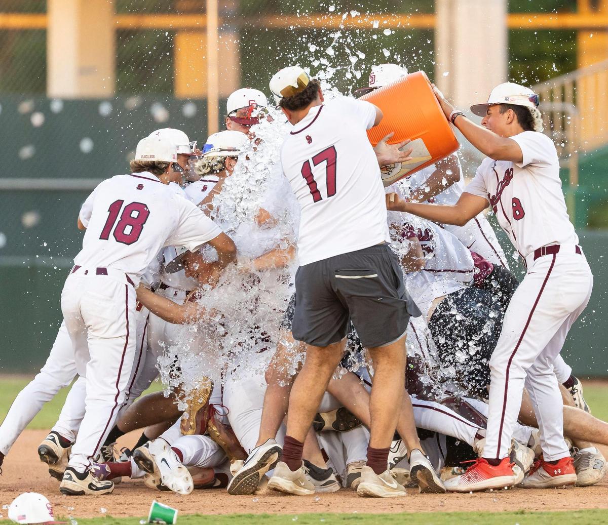 Stoneman Douglas Eagles celebrate after they defeated the Jupiter Warriors in their Class 7A state baseball championship game at Hammond Stadium on Saturday, May 17, 2025, in Fort Myers, Fla.