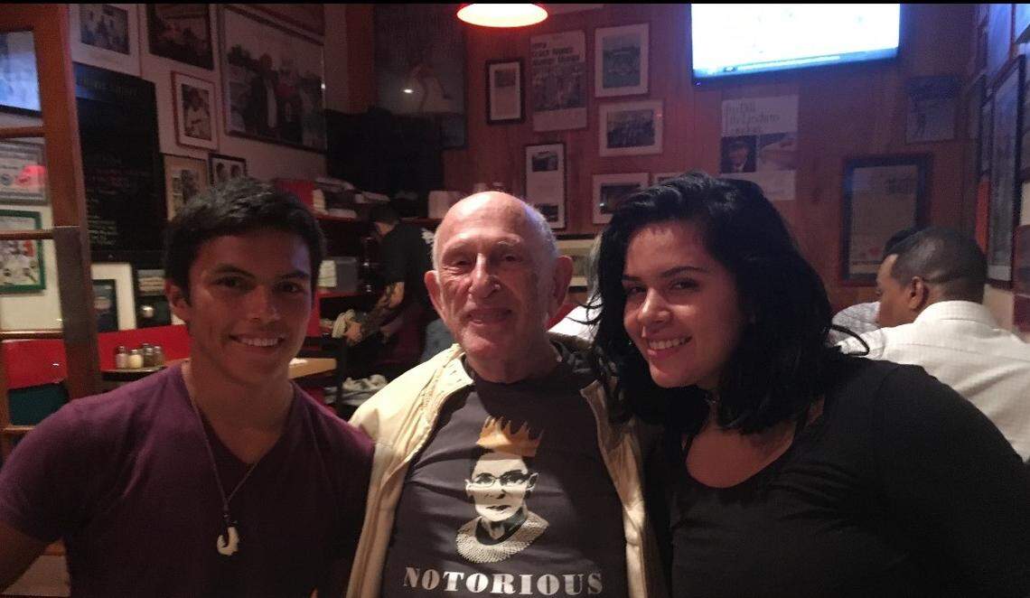 David Hertzig, center, died of his injuries Saturday after a hit-and-run driver plowed into him as he rode his bicycle to class Monday. He is pictured with two of his 12 grandchildren.