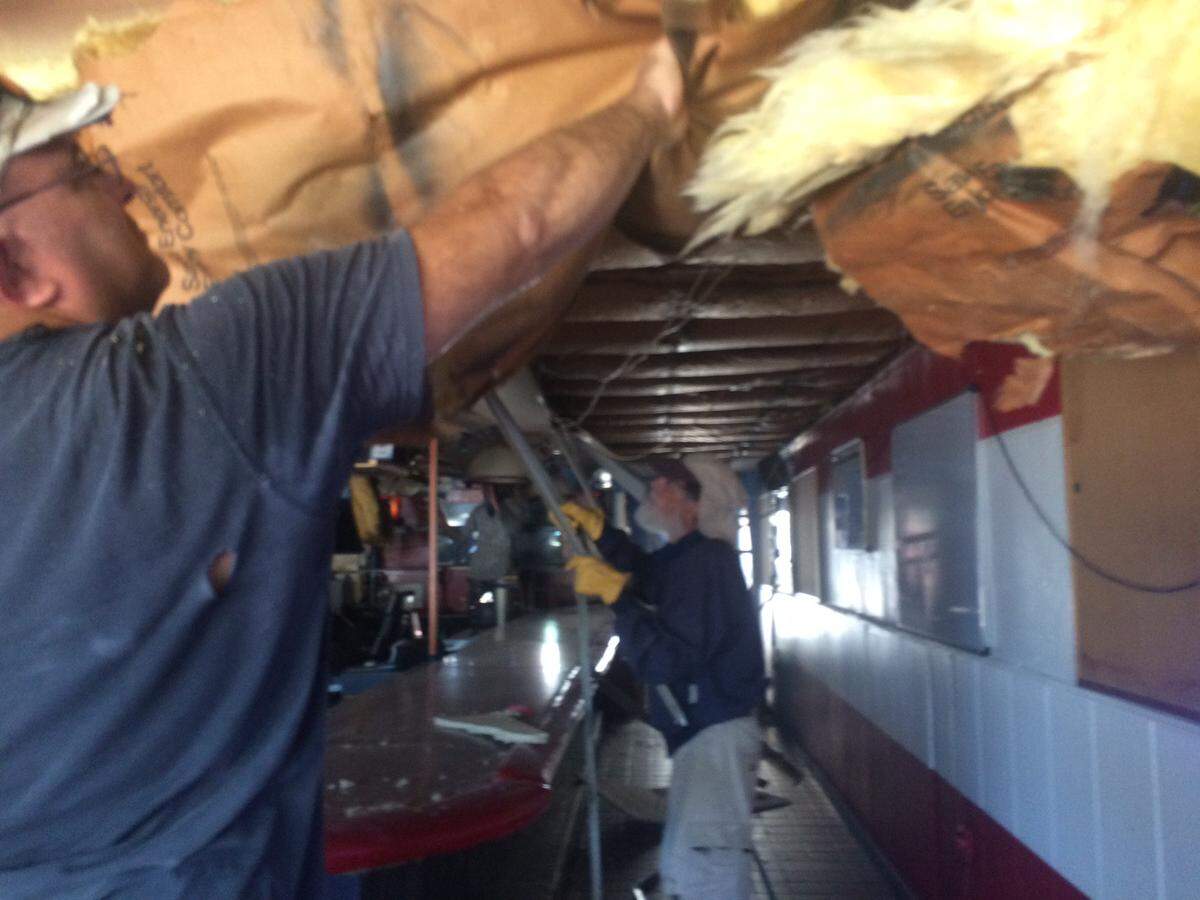 Jason Kendall, the new quartermaster of VFW Post 10211, rips out the drop ceiling over the bar.