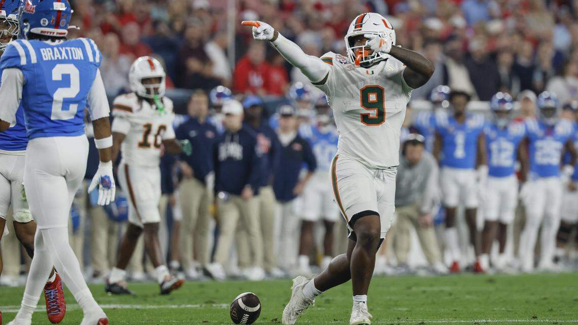 Miami Hurricanes tight end Elija Lofton (9) signals a first down against the Mississippi Rebels during the first half of a College Football Playoff semifinal in the Fiesta Bowl at State Farm Stadium on Thursday, January 8, 2026 in Glendale, Arizona.