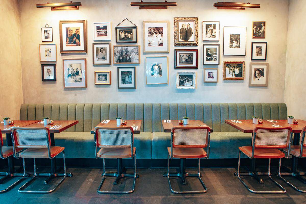 The interior of the new Colada Cuban Café is filled with family photos.