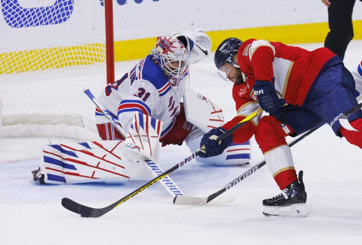 Florida Panthers right wing Kyle Okposo (8) takes a shot on New York Rangers goaltender Igor Shesterkin (31) during the third period of Game 4 of the Eastern Conference finals of the NHL hockey Stanley Cup playoffs at the Amerant Bank Arena on Tuesday, May 28, 2024, in Sunrise, Fla.