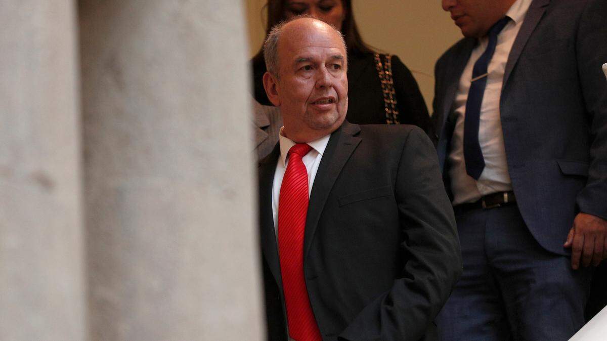 In this file photo, Bolivia’s Government Minister Arturo Murillo walks down a set of stairs at the government palace in La Paz on Jan. 28, 2020.
