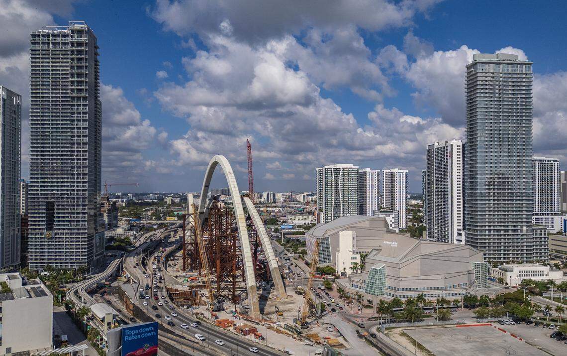 View of the ongoing construction of the arches for the I-395 signature bridge as part of the I-395/I-95 Design-Build Project, in front of the Adrienne Arsht Center, in downtown Miami, on Thursday, March 26, 2026.