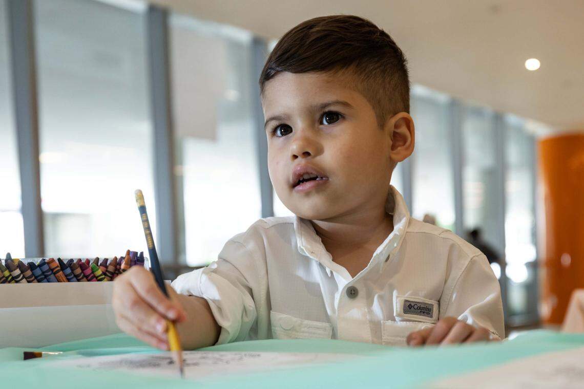 Riley Alvarez, 3, draws during a Peanuts PaintFest event with the Comic Kids nonprofit as they celebrate the "Peanuts" comic strip turning 75 at Nicklaus Children's Hospital Main Campus on Thursday, October  2, 2025, in Miami, Fla.