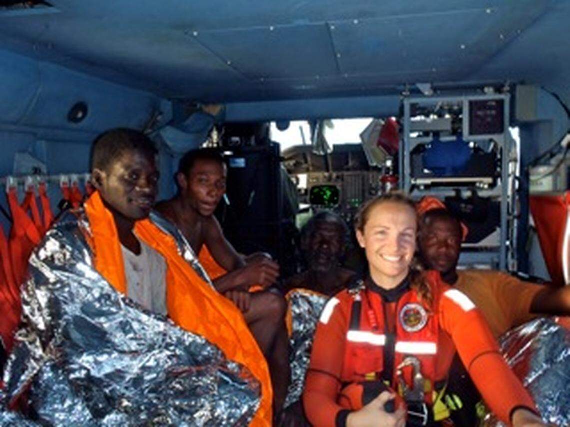 A Coast Guard photo published in 2012 shows Faulkner with four rescued Bahamian fishermen.
